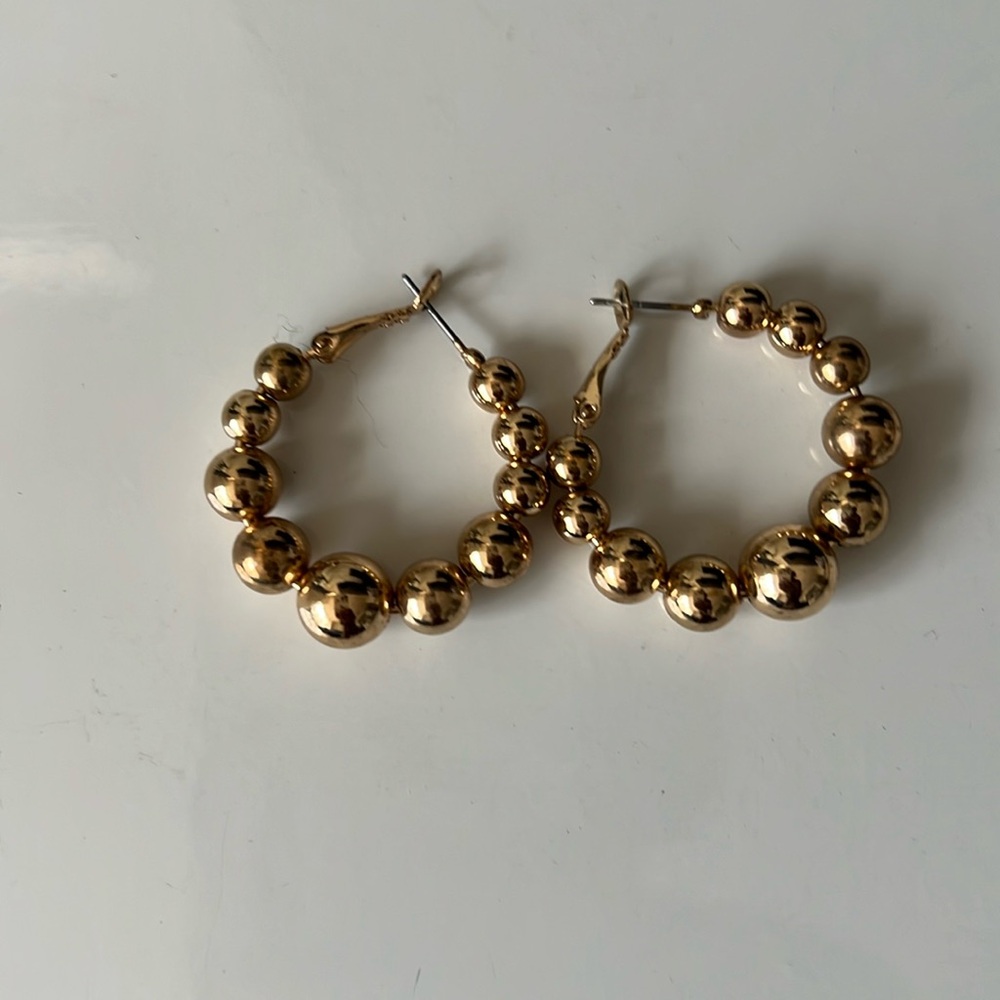Gold tone bubble hoop earrings